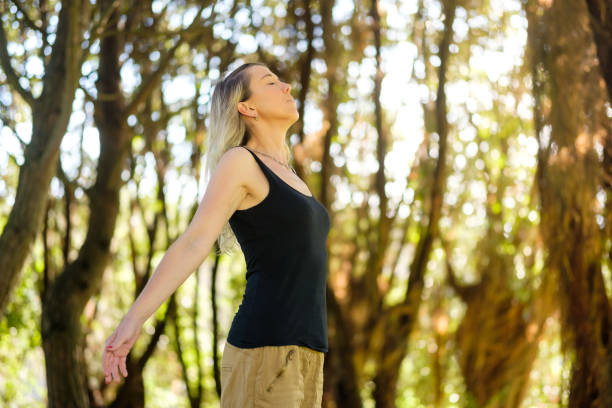 istock Woman taking a deep breath in nature 2183651733