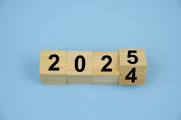 istock Cubes with numbers 2024 and 2025 on blue background. 2183657299