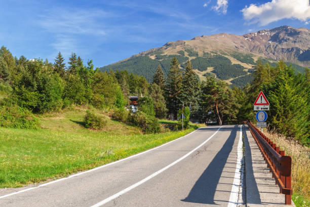 istock Mountain road in italian alps summer landscape 2183659559
