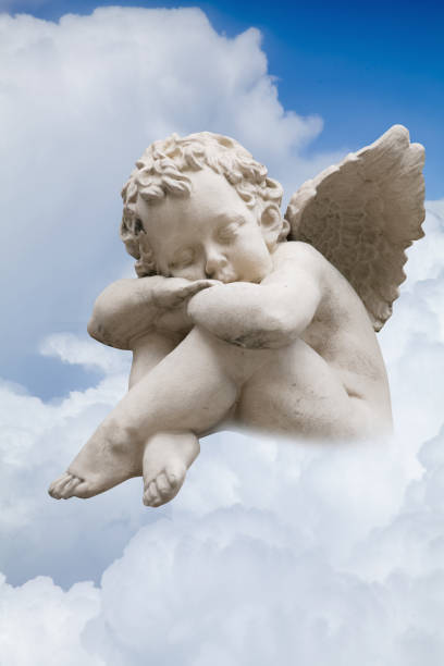 istock A little angel sleeps on a cloud. 2183661172