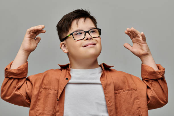 istock A joyful boy with Down syndrome expressing emotions in a bright setting 2183663128