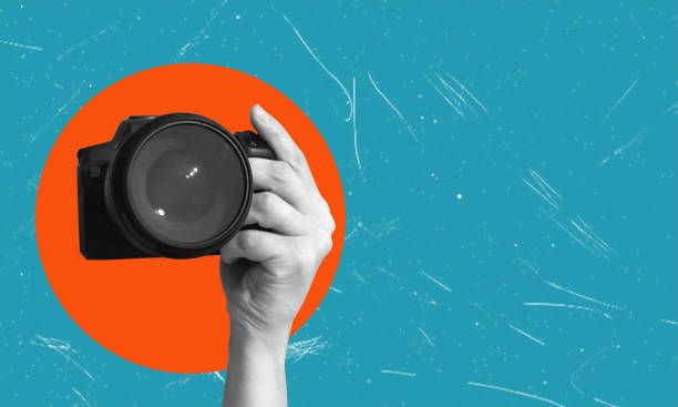 istock Contemporary art collage. Hand-holding camera in monochrome filter on pink background. 2183663141