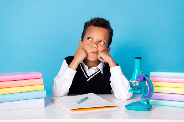 istock Portrait of minded creative schoolkid look curious empty space contemplate isolated on blue color background 2183668507