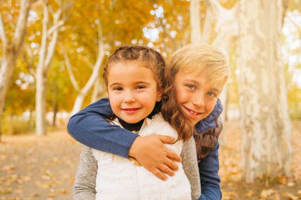 Children have fun in an autumn landscape. Madrid, Spain.