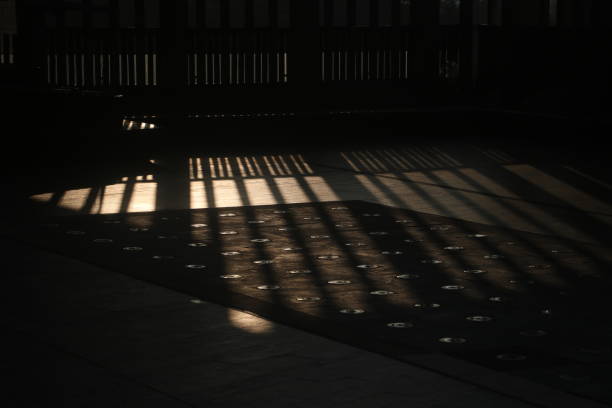 istock sunrise in morden building shadow 2183669061
