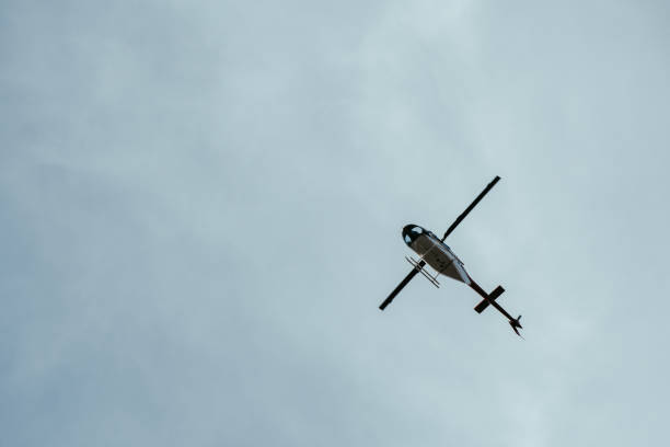 Helicopters fly through the swiss alps throughout winter taking vacationers on joy flights as well as providing safety against avalanches and rescue