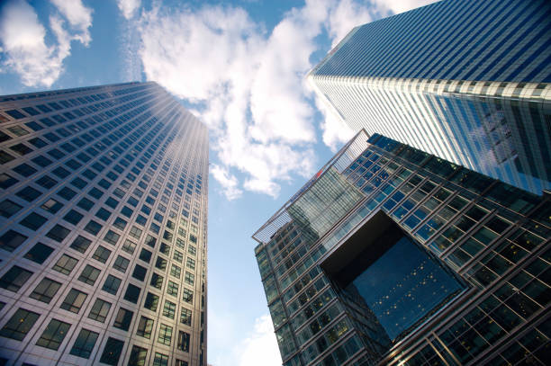 Modern office buildings dominate the skyline of canary wharf, a major business district in london, showcasing contemporary architecture and reflecting the city's dynamic financial hub