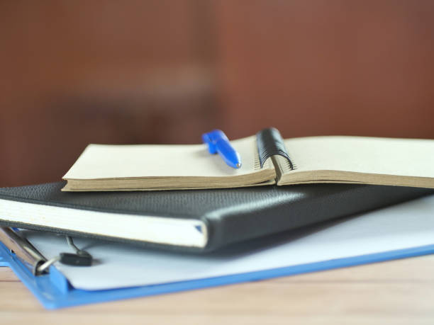 istock Pen and notebook on the desk. Financial business concept. 2183674942