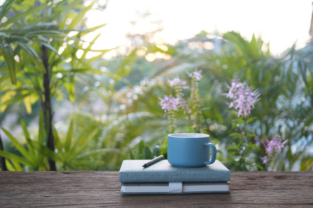 istock blue cup and notebooks on wooden table 2183675856
