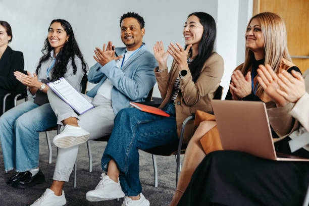 istock Engaged coworkers clapping during a corporate event 2183680251