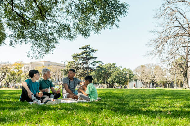istock Family doing a picnic on the public park 2183680638