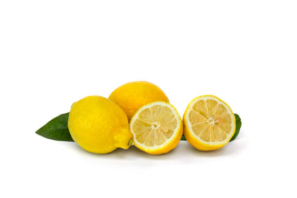 istock Lemons and halfs with leaves on a white background with space for text 2183681576
