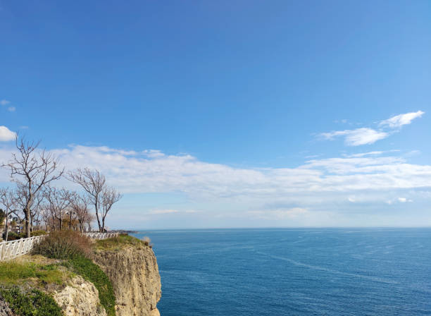 Beautiful calm blue Mediterranean sea and rocky a cliff
