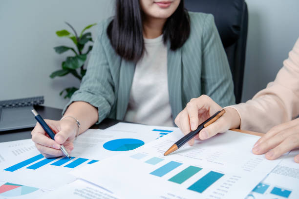 istock Two female employees, we are discussing work together 2183683682
