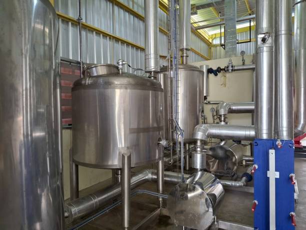 istock piping system, pressurized stainless steel tank in industrial area 2183687620
