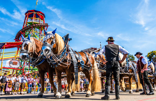Munich, Germany - September 22: participants with tradtional clothes at the opening parade for the annual oktoberfest in munich on September 22, 2024