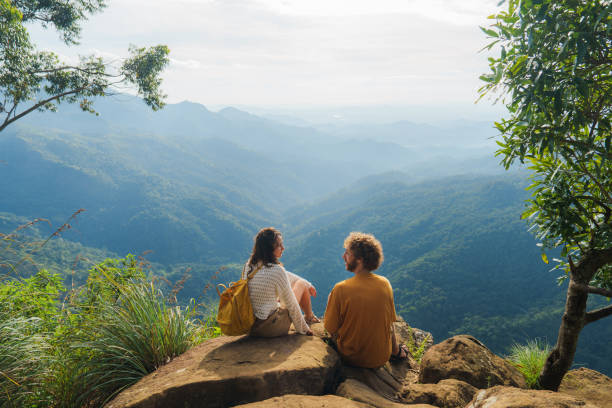 Man and woman bonding while  hiking in Sri Lanka