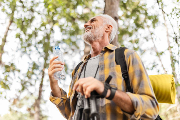 istock Senior Man Hiking Taking a Break Hydrating 2183697199