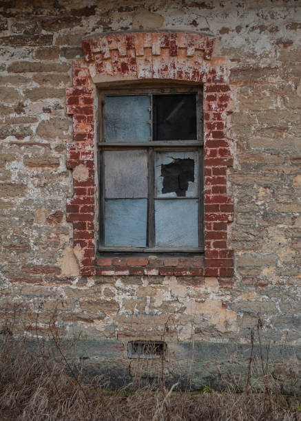 istock Old wooden window on the ancient abandoned house 2183699435