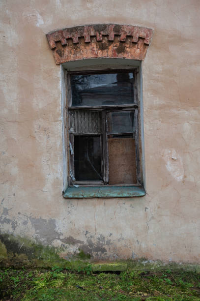 istock Old wooden window on the ancient abandoned house 2183699592