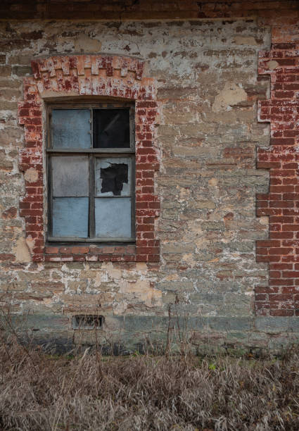istock Old wooden window on the ancient abandoned house 2183699620