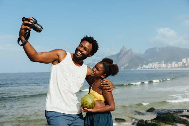 istock Father and daughter taking a selfie at Ipanema Beach 2183701754