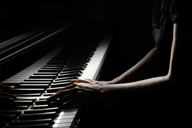 istock Piano player. Pianist hands playing grand piano keys 2183703920