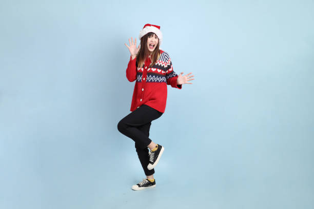 istock Woman wearing Santa hat 2183705640