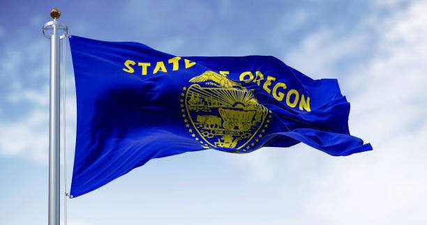 istock Oregon state flag waving in the wind on a clear day 2183706322