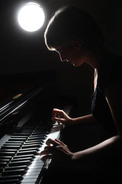 istock Pianist playing grand piano musical instrument 2183709349