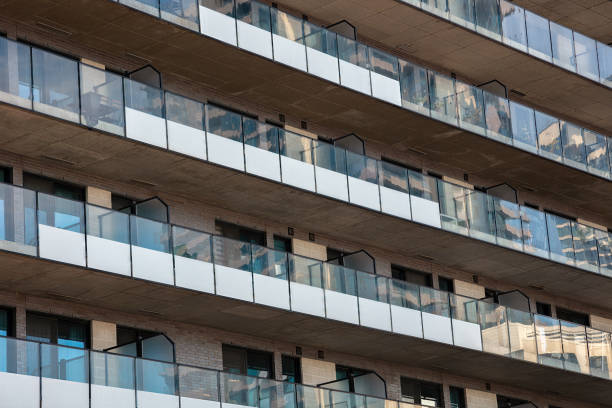 istock Modern Apartment Building with Glass Balconies Reflections 2183710409