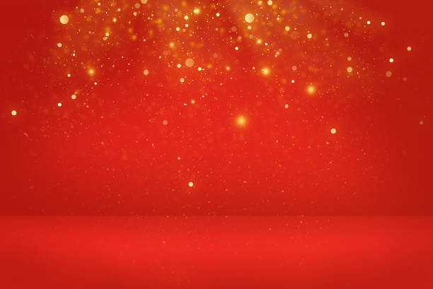 Red soft focus background with gold bokeh lights and sparkles.
