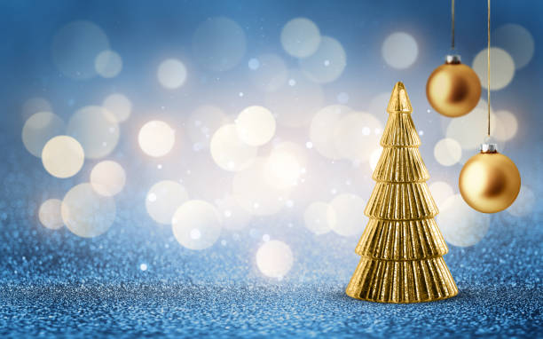 istock Gold Christmas tree and hanging bauble on shiny glitter blue background with bokeh light. Festive winter holiday decoration and ornament. 2183710933