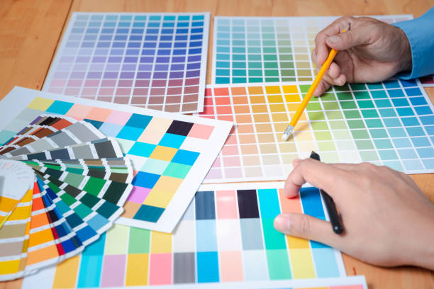 istock Interior designer chooses a color chart for home design. Graphic designers working on color chart at modern office. 2183711987