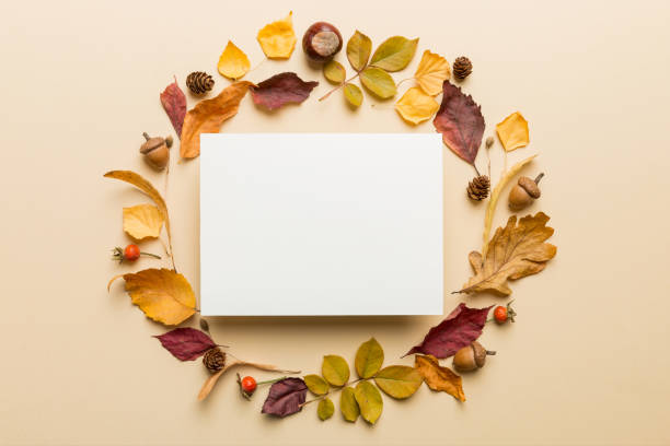 istock Autumn composition with paper blank and dried leaves on table. Flat lay, top view, copy space 2183712100
