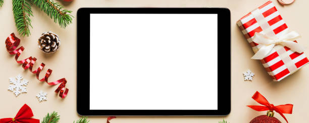 istock Digital tablet mock up with rustic Christmas decorations for app presentation top view with empty space for you design. Christmas online shopping concept. Tablet with copy space on colored background 2183712134