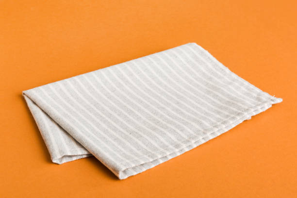 istock top view with gray kitchen napkin isolated on table background. Folded cloth for mockup with copy space, Flat lay. Minimal style 2183712178
