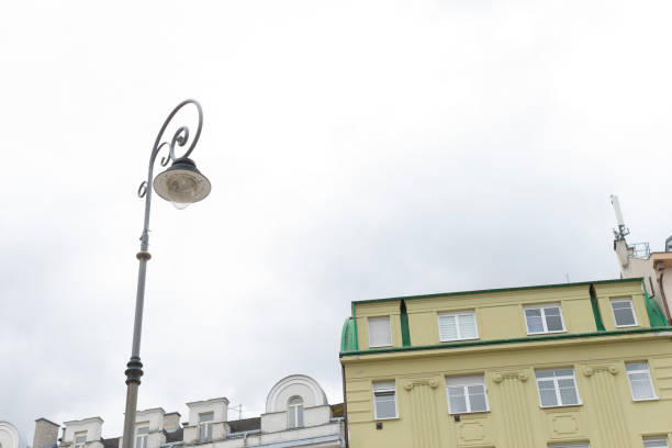 istock A street light is standing tall in front of a large building 2183712239