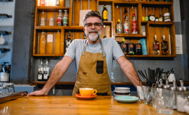 istock Mature male barista at work 2183712303