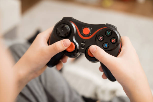 istock Close-up of hands holding a video game joystick from the console. 2183712758