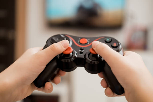 istock Close-up of hands holding a video game joystick from the console. 2183712769