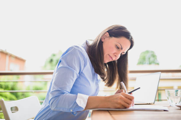 istock Lifelike Woman Working Remotely 2183715637