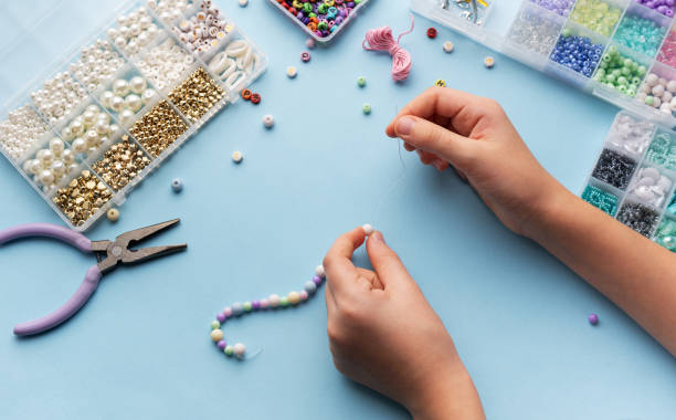 istock Creating colorful beaded jewelry with vibrant materials on a crafting table 2183716177