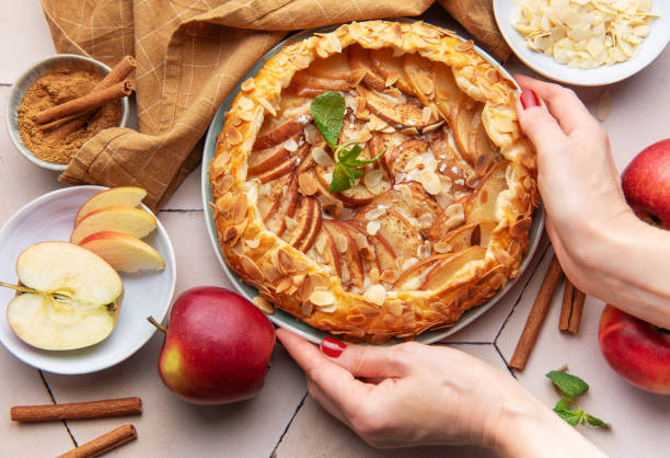 istock Apple galette preparation with fresh ingredients and spices on a kitchen countertop 2183716271