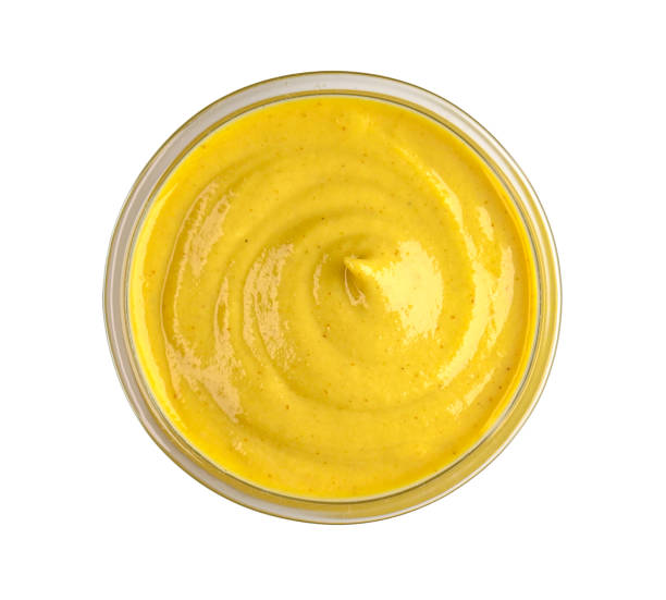 istock Round glass bowl with yellow mustard isolated on white, top view, clipping path 2183716470