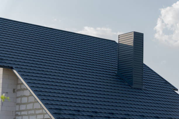 istock This beautifully crafted roof features modern shingles with a striking chimney, perfectly situated under a serene afternoon sky, enhancing the home's aesthetic 2183716781
