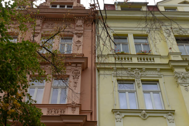istock There is a yellow building and a pink building located right next to each other 2183716863