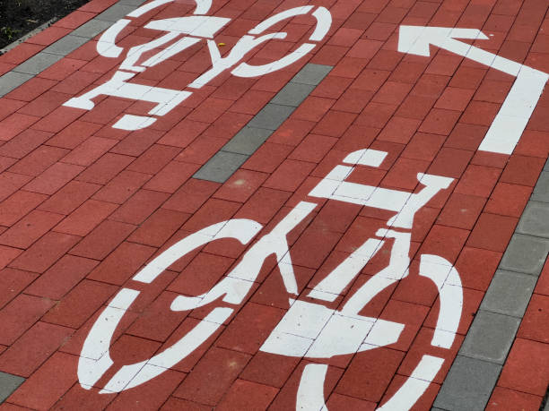 istock A well-maintained path features distinct bicycle lane designs, directing cyclists safely through a bustling city area, enhancing cycling accessibility 2183716876