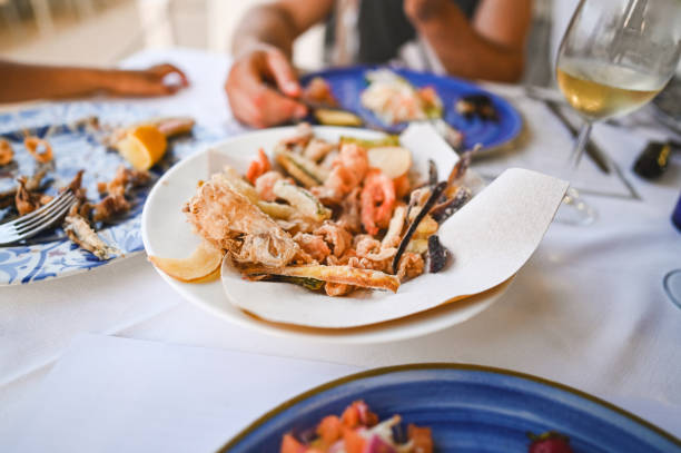 istock Eating at fish and seafood restaurant. 2183717650