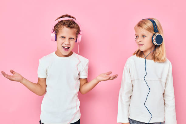 istock Active young people dancing with headphones entertainment isolated background 2183721244